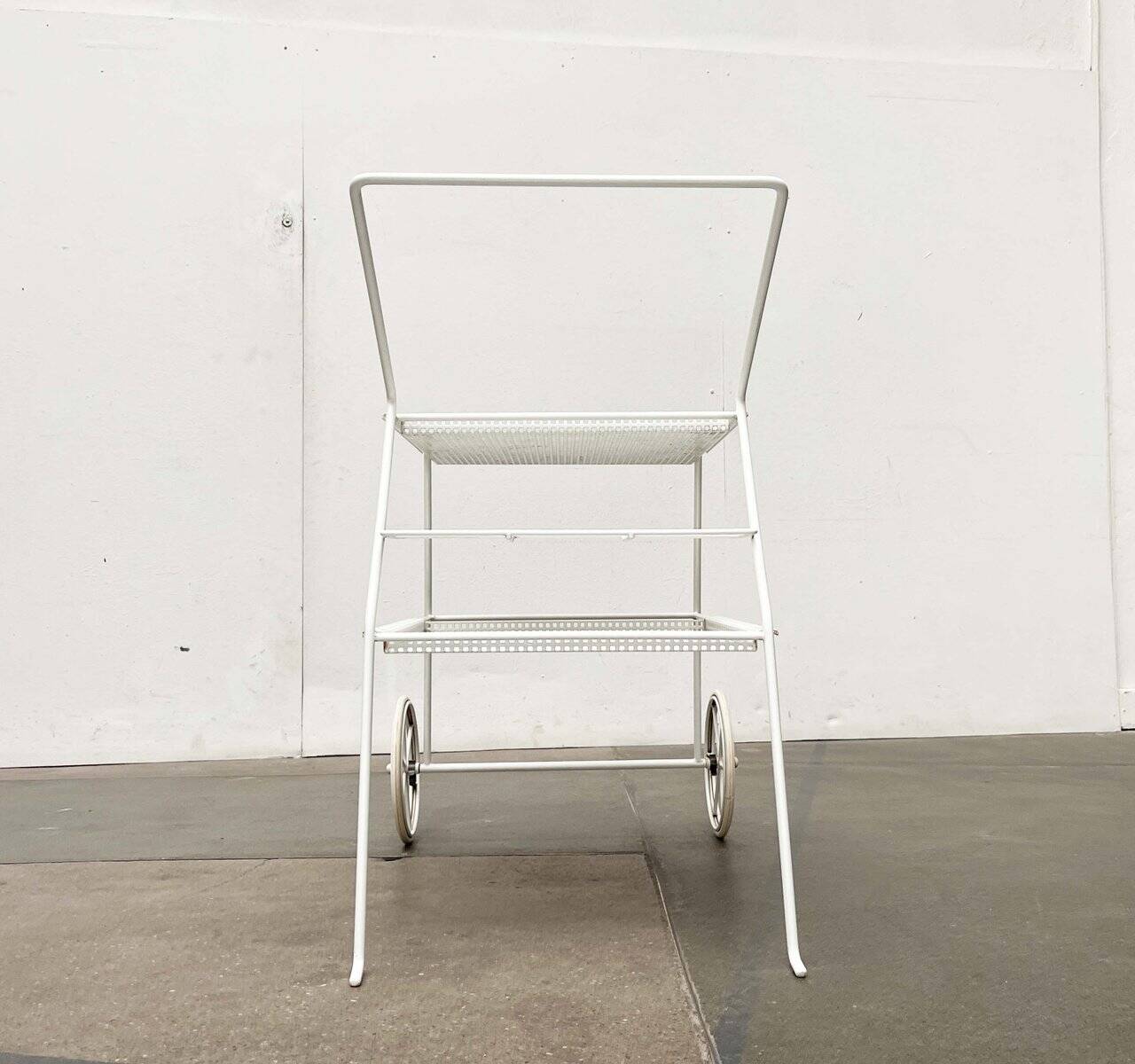 Mid-century modern minimalist perforated metal bar cart from the 1960s.