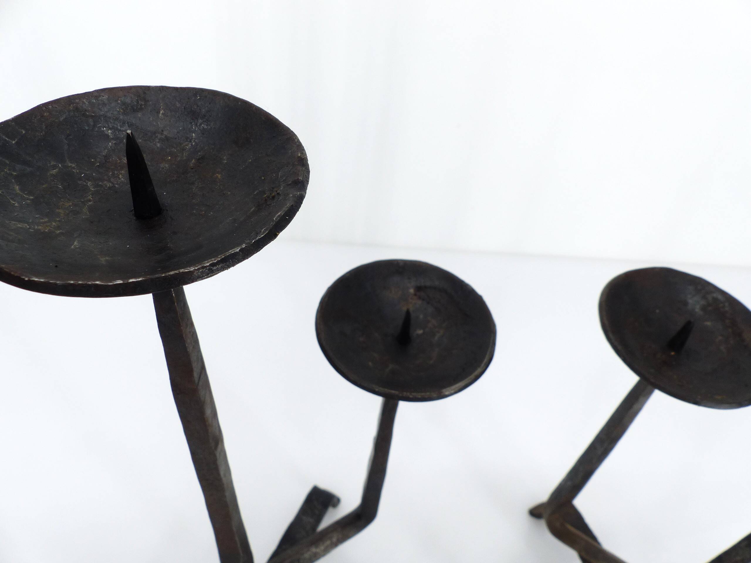 Pair of brutalist wrought iron candlesticks, France, three lights, signed