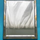 Faceted modernist wall mirror in steel and brass, geometric mixed metal frame 1970s.