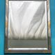 Faceted modernist wall mirror in steel and brass, geometric mixed metal frame 1970s.