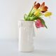 White glazed ceramic vase with face