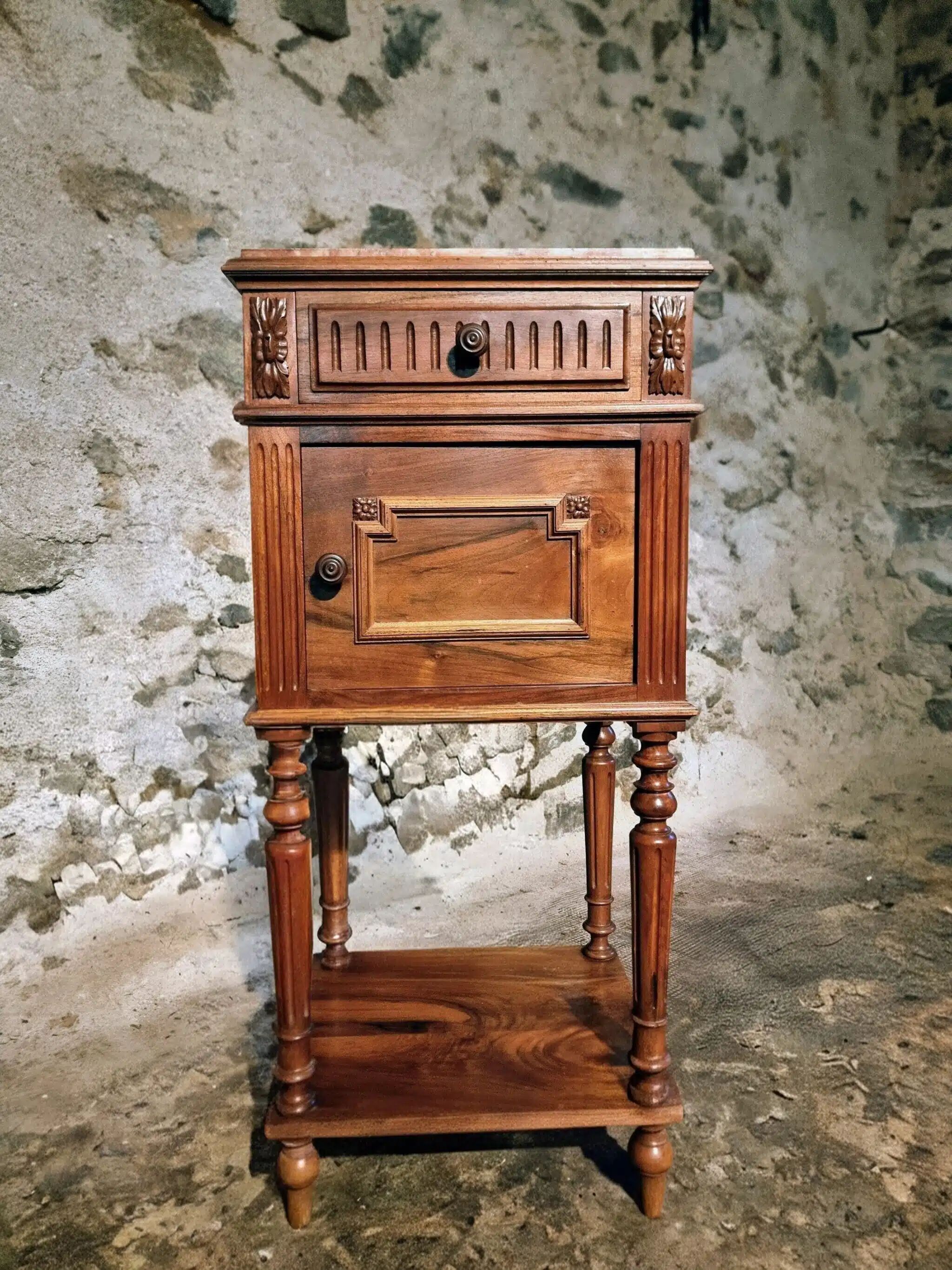 Antique French bedside table with a marble top.