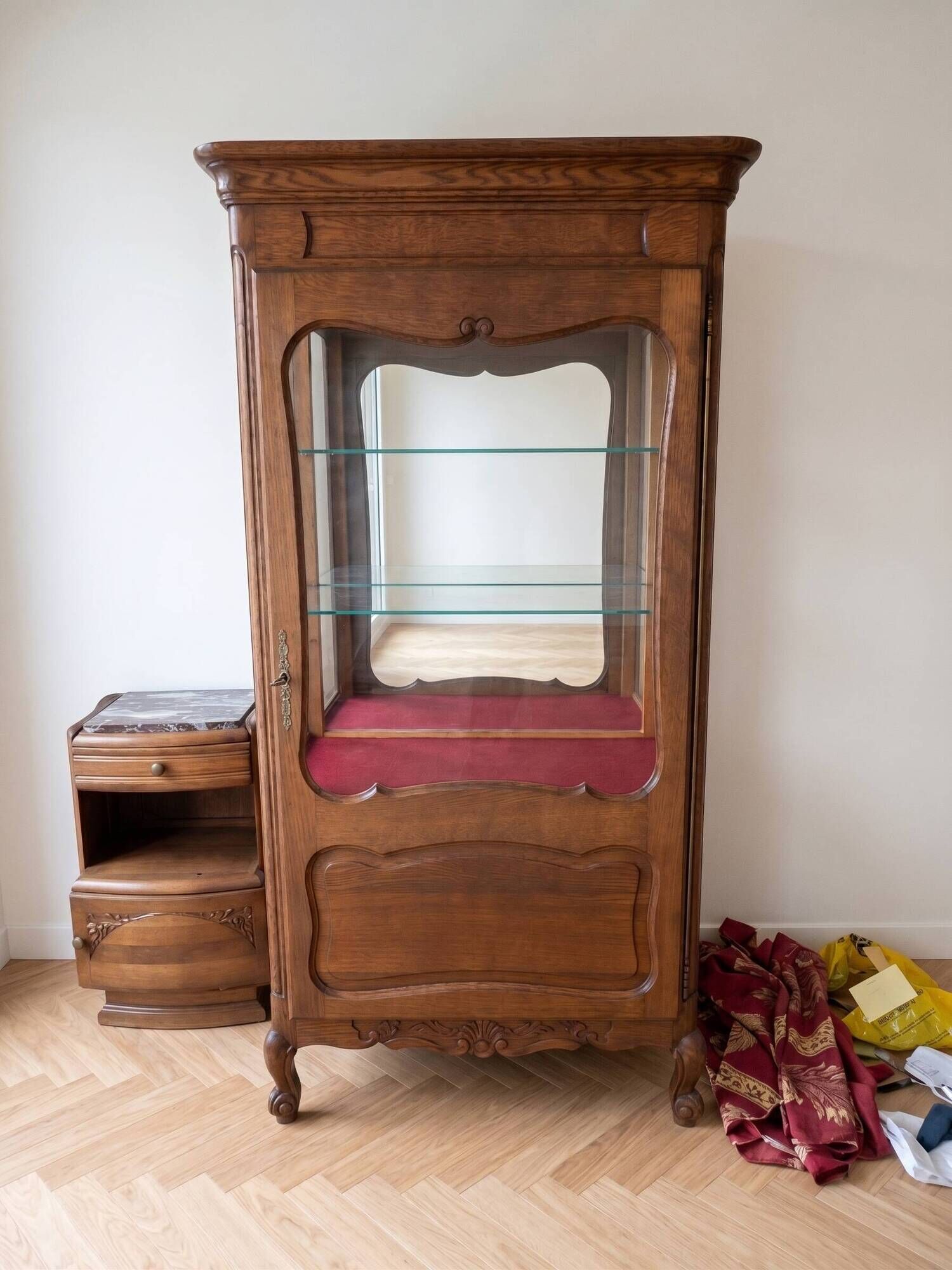 Vintage wooden display cabinet with glass shelves.