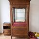 Vintage wooden display cabinet with glass shelves.