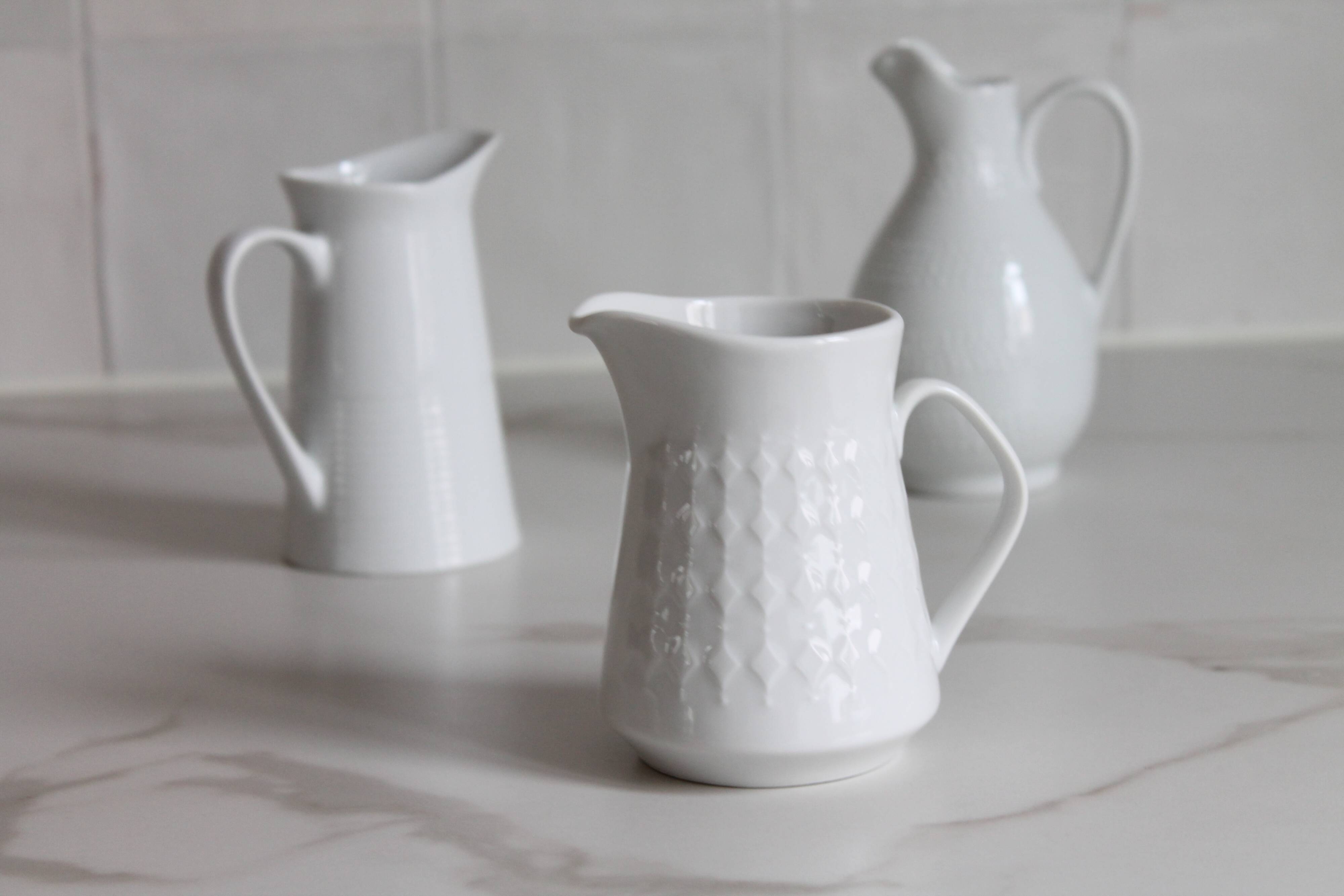 3 old French pitchers in white ceramic
