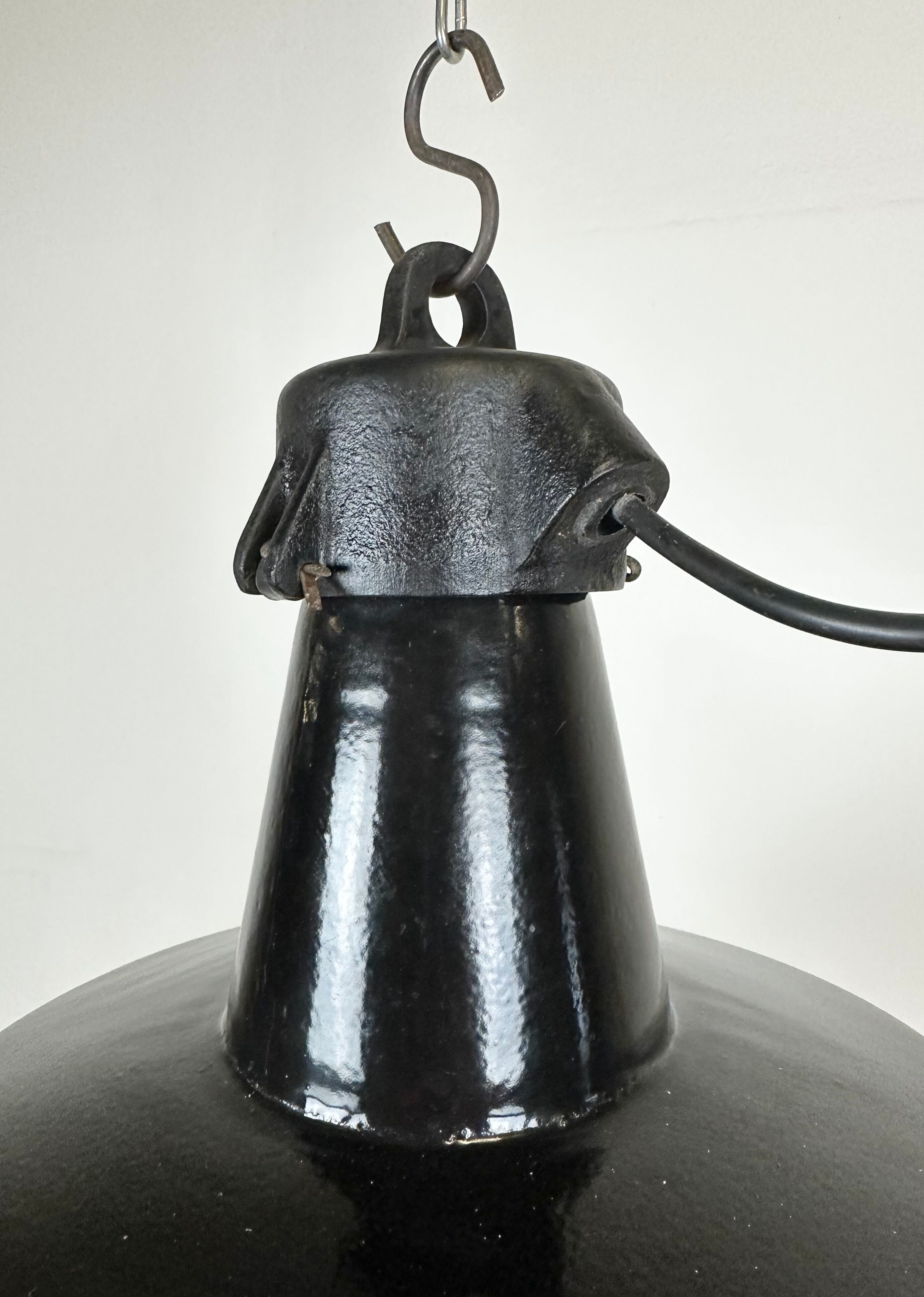 Industrial black enamel factory lamp with cast iron top, 1960s