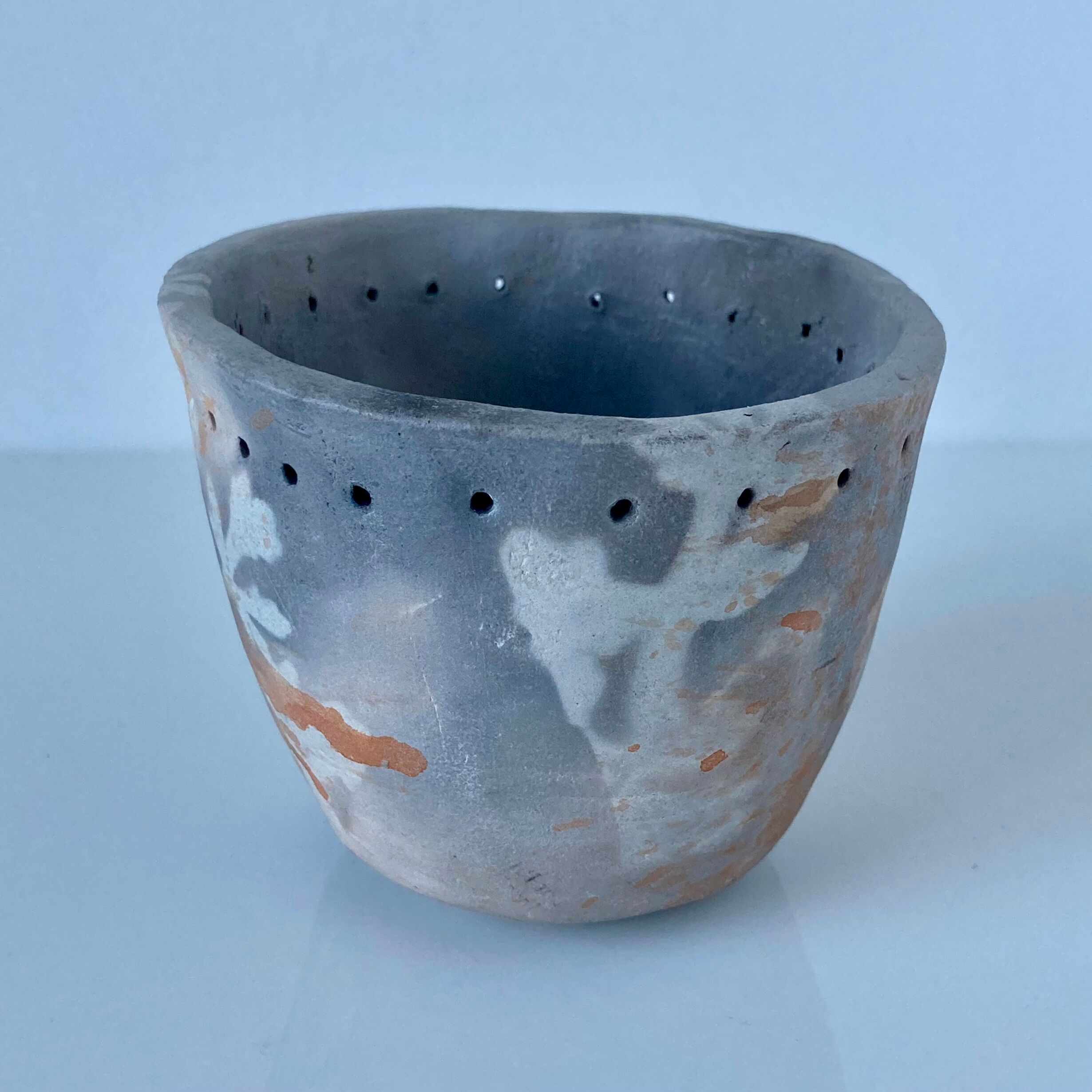 Signed ceramic pot with plant decoration