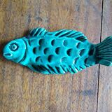 9 knife holders in green earthenware in the shape of a fish