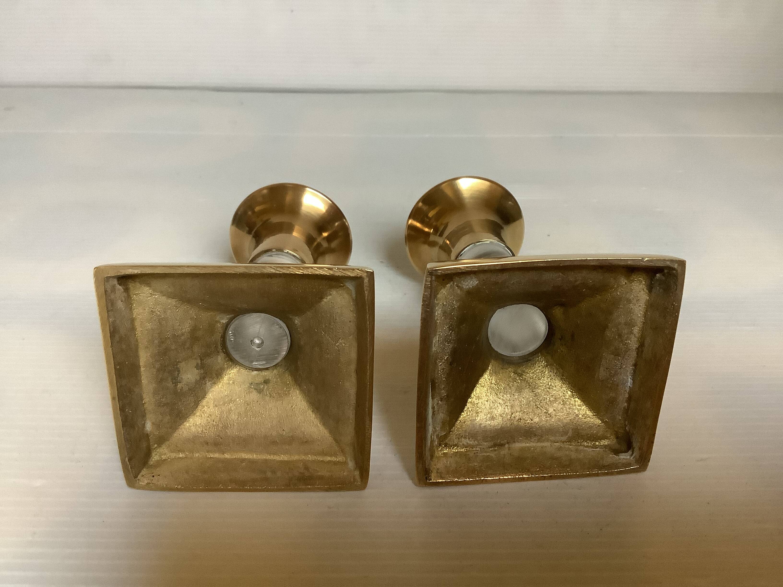 Pair of small brass and glass candlesticks