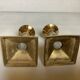 Pair of small brass and glass candlesticks