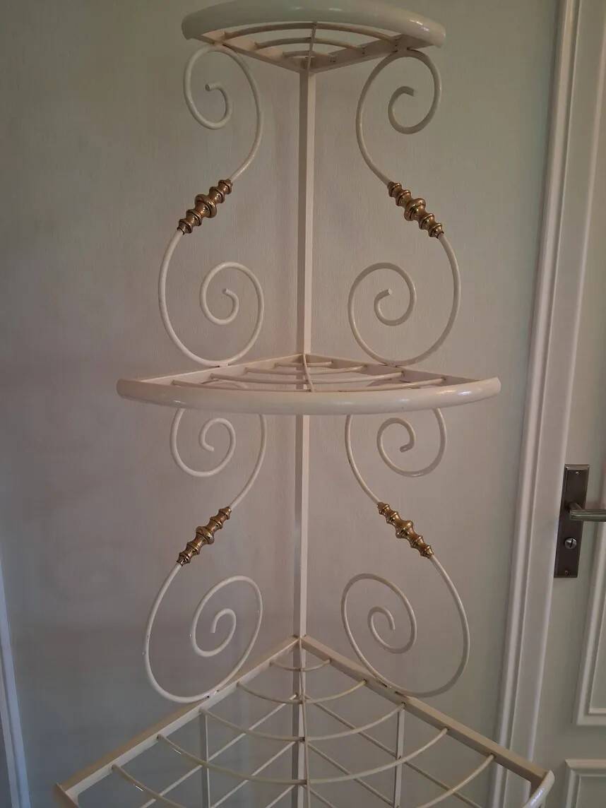 Cream and brass corner bakery shelf in wrought iron