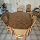 Oval cherry wood table made by a cabinetmaker, with 3 extensions and 8 chairs.