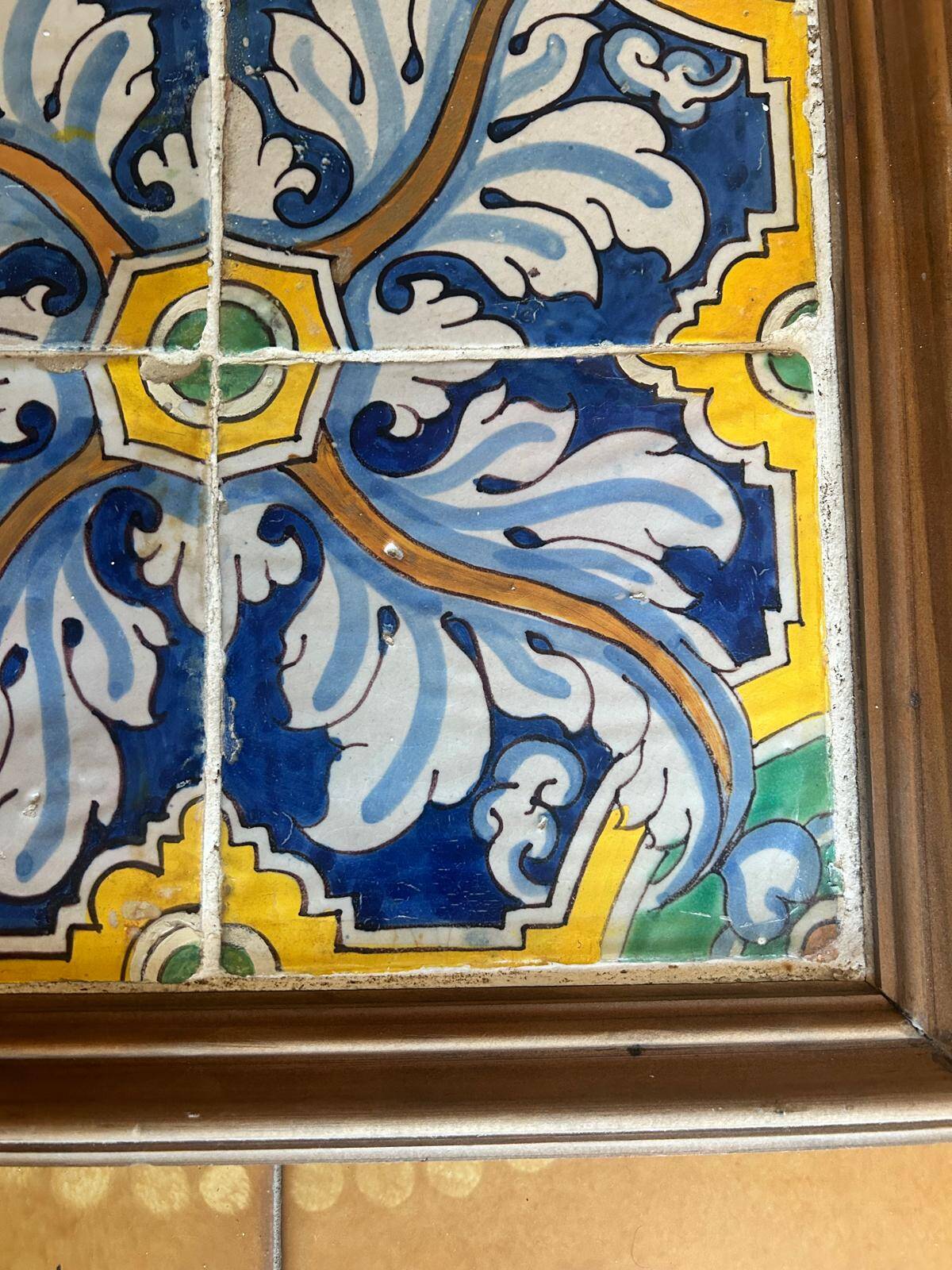 Panel of four Catalan tiles, 17th century, framed.