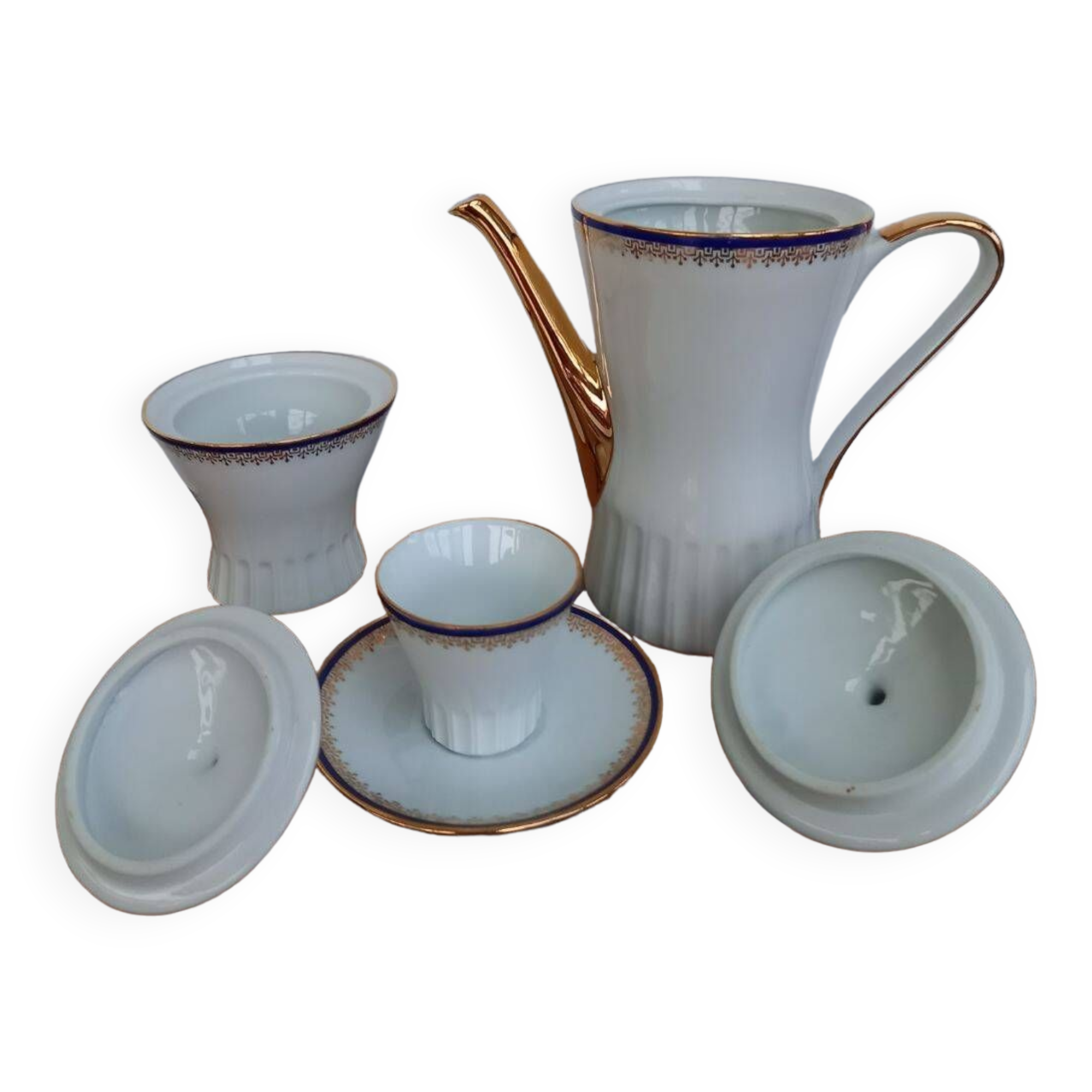 Coffee pot, sugar pot, 1 cup and saucer.