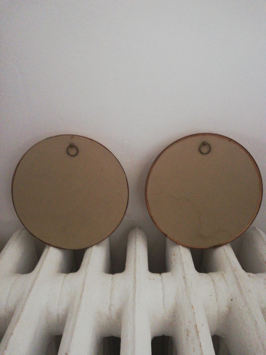 Pair of miniature gold round frames