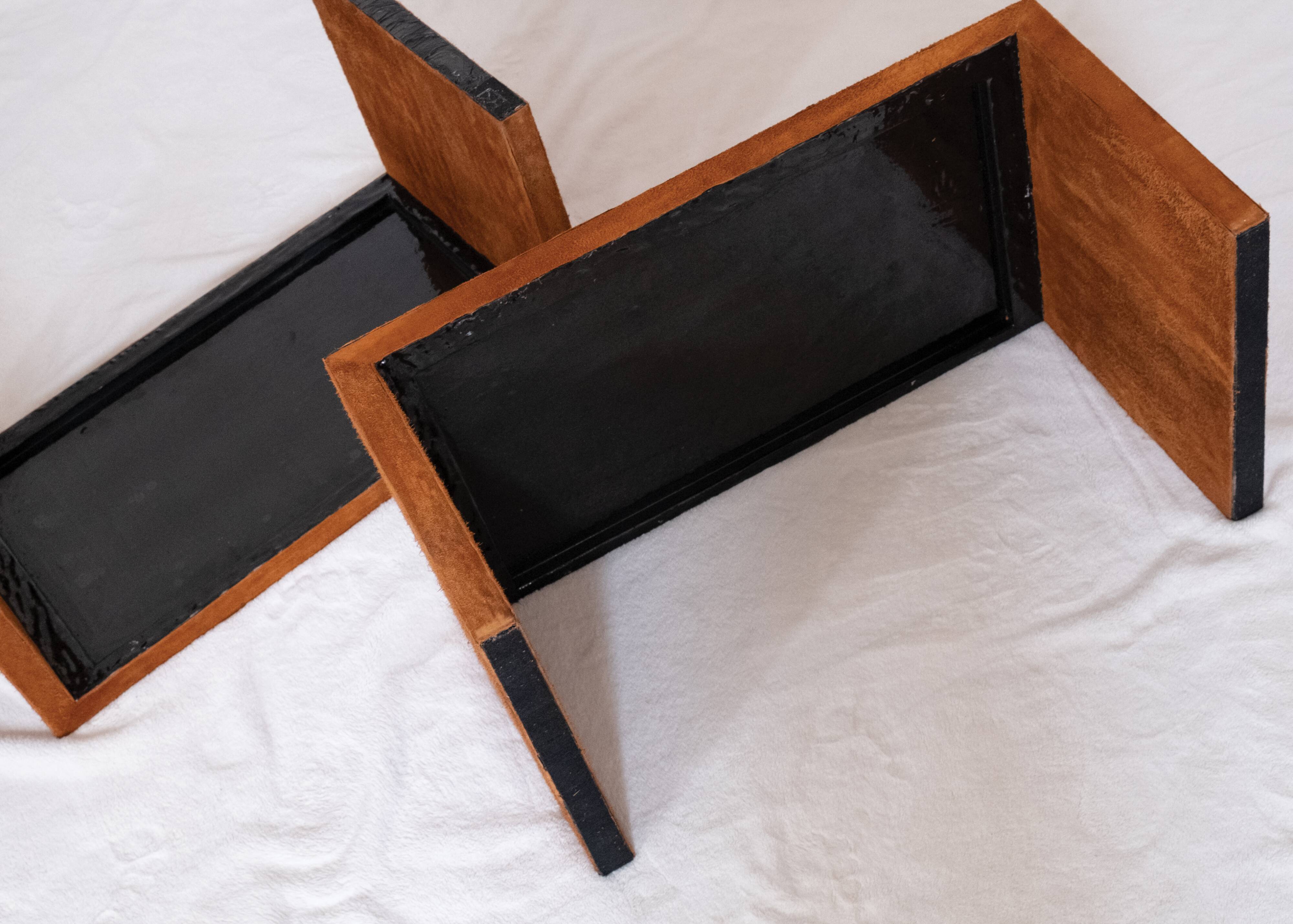 Pair of cognac suede side tables in the style of Jean Michel Frank.