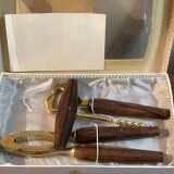 Bottle opener made of teak wood, corkscrew and nutcracker