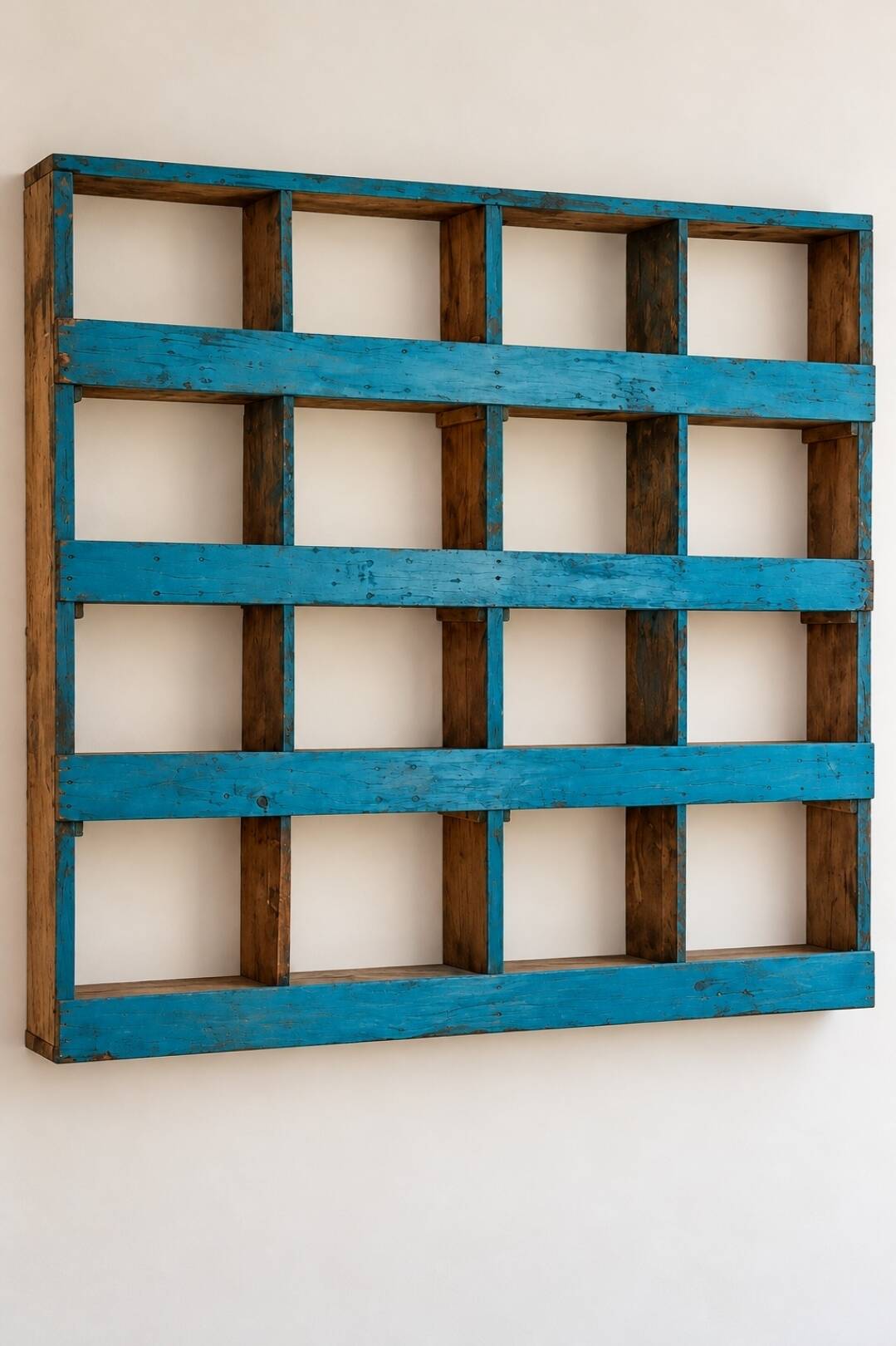 Antique wall cabinet in patinated turquoise blue wood, workshop style.