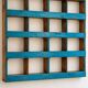 Antique wall cabinet in patinated turquoise blue wood, workshop style.