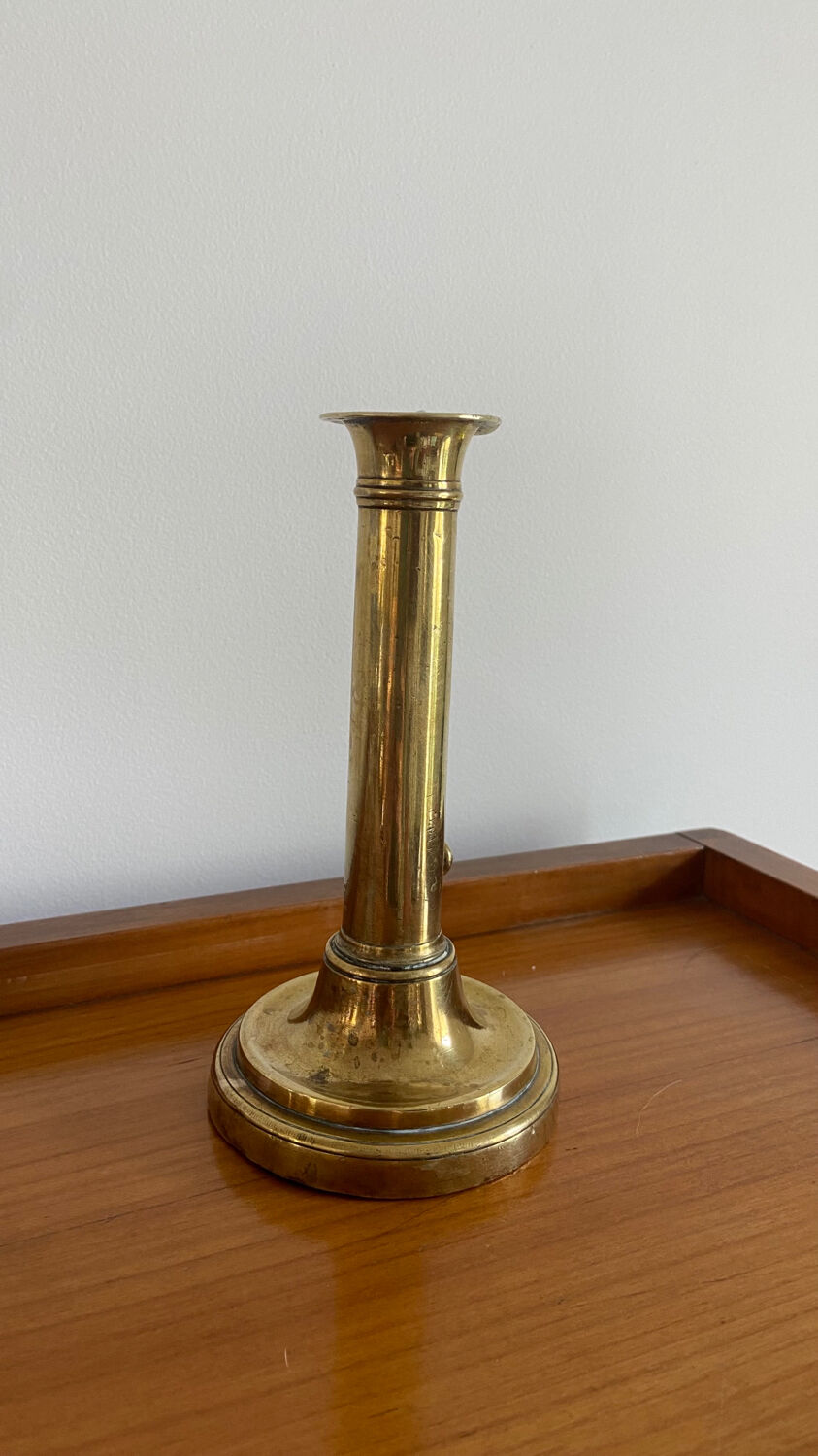 Old brass push candle holder
