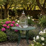 Vintage hexagonal metal birdcage from around 1940.