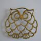 Vintage openwork brass trivet in the shape of an owl or owl