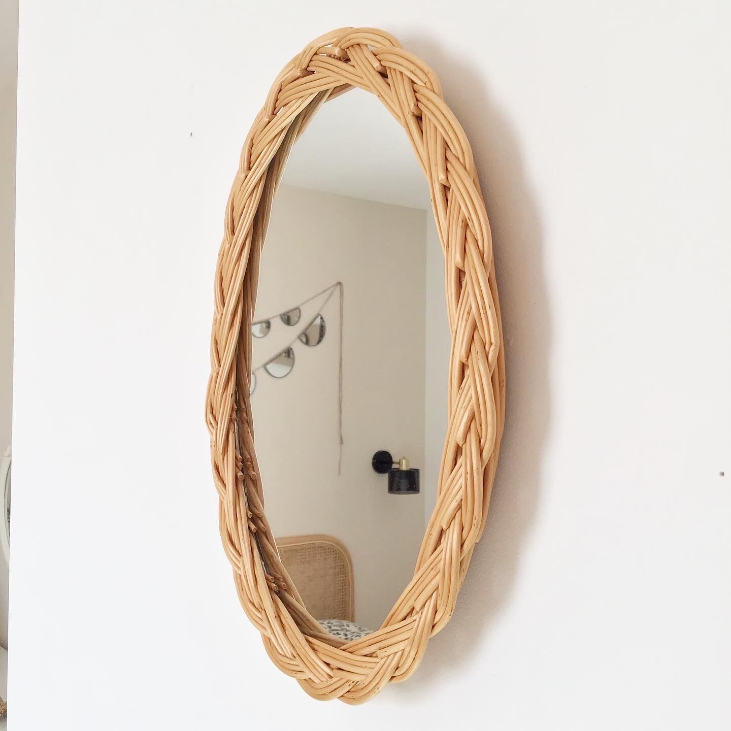 Vintage oval rattan mirror