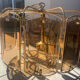 Brass and tinted glass pendant light