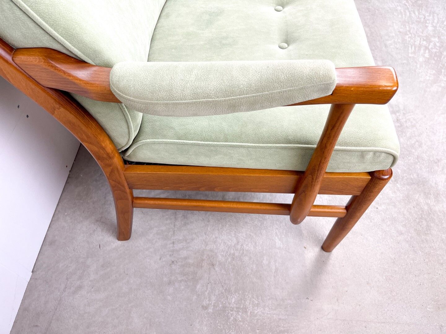 Two-seater sofa from the sixties with green upholstery