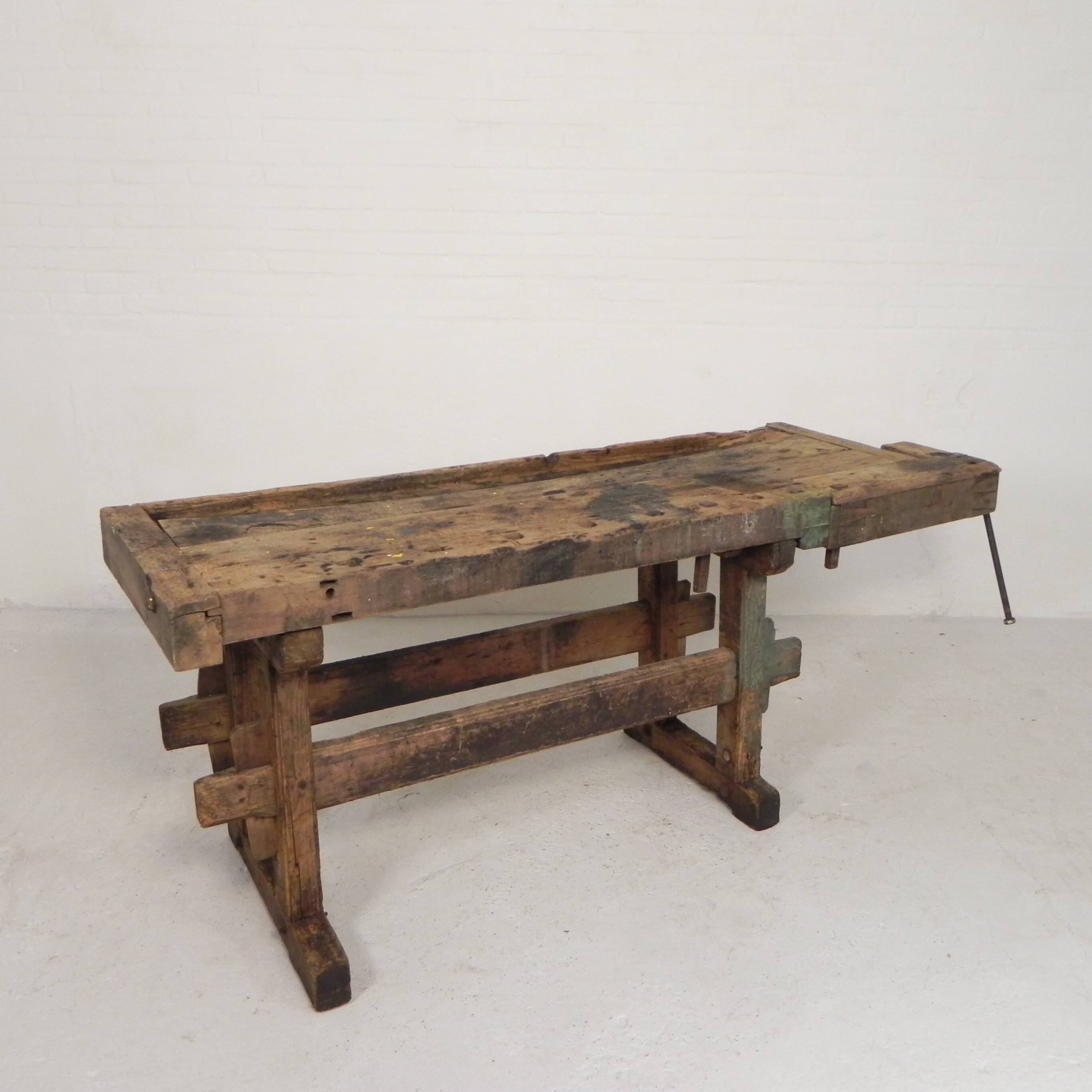 Wooden industrial workbench with vice, 194 cm long, 1930s.