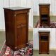 Empire bedside table from the 19th century in cherry wood and black marble.