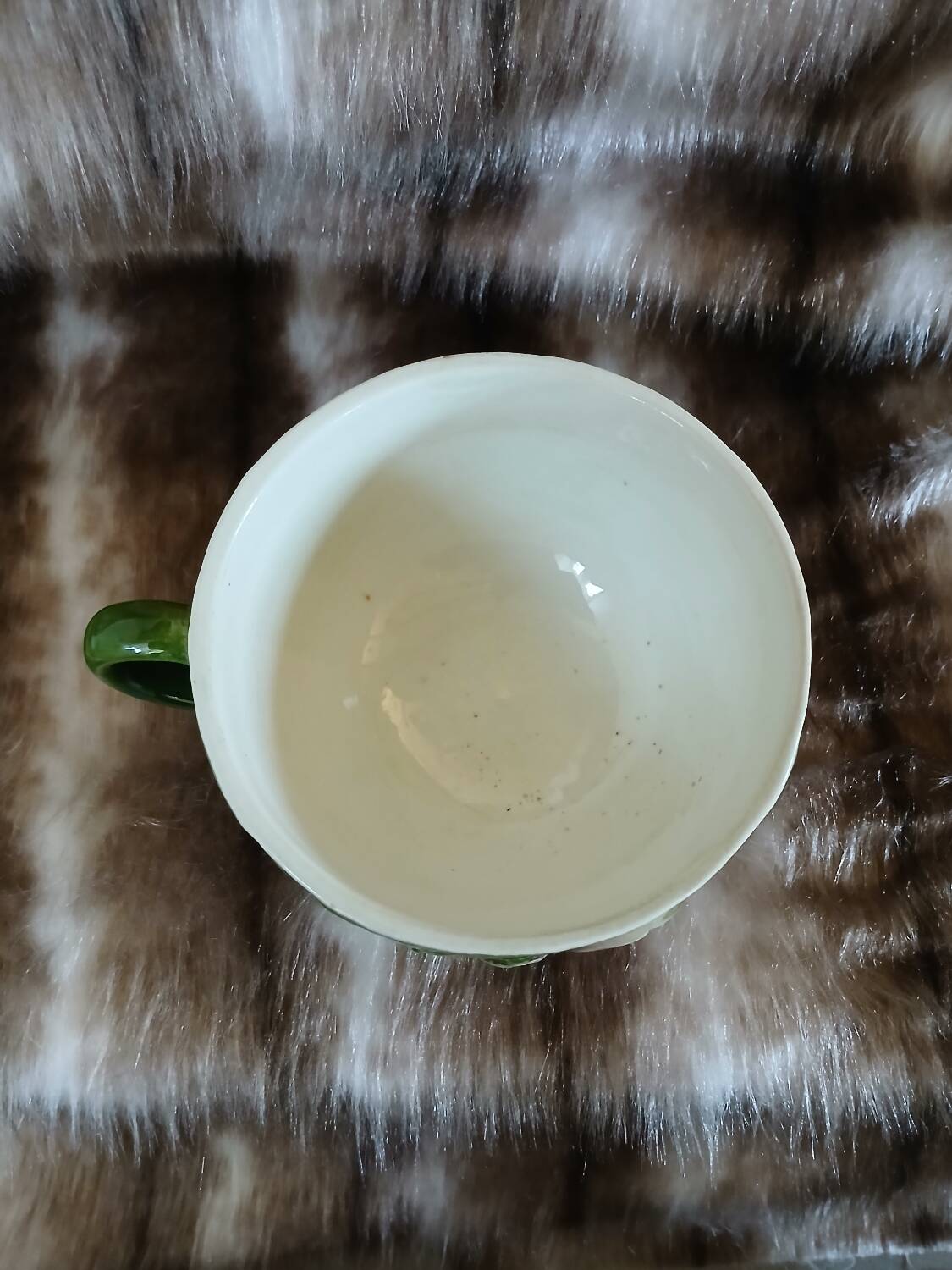 Antique cup and saucer in slipware.
