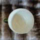 Antique cup and saucer in slipware.