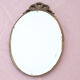 Oval mirror wood knot