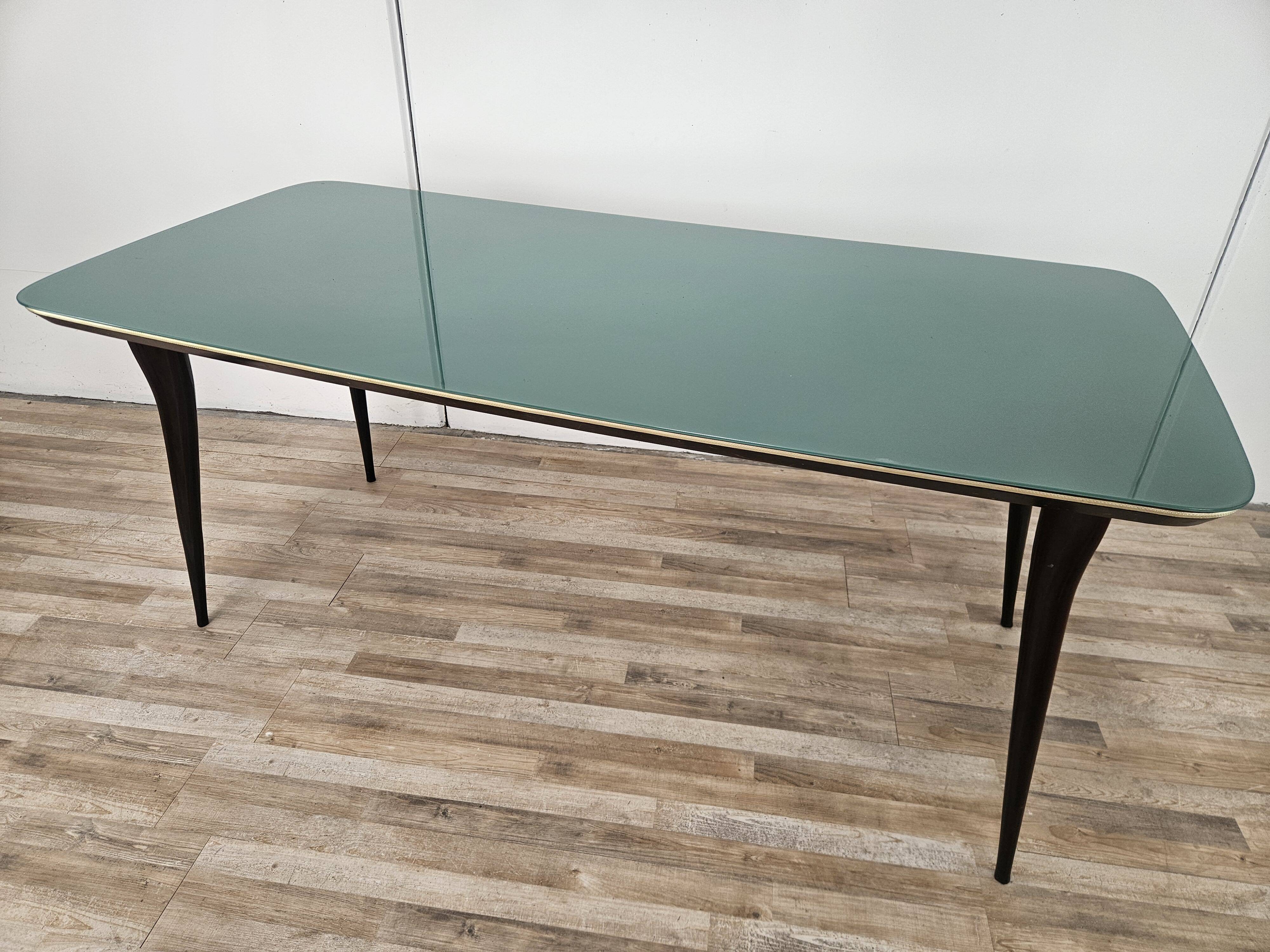 Mid-century mahogany dining table with aquamarine glass top