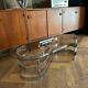 70s design oval coffee table in glass with chrome legs.