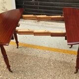 Old-pane-top round table in mahogany