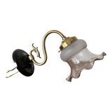 Swan neck wall light in brass with glass tulip.