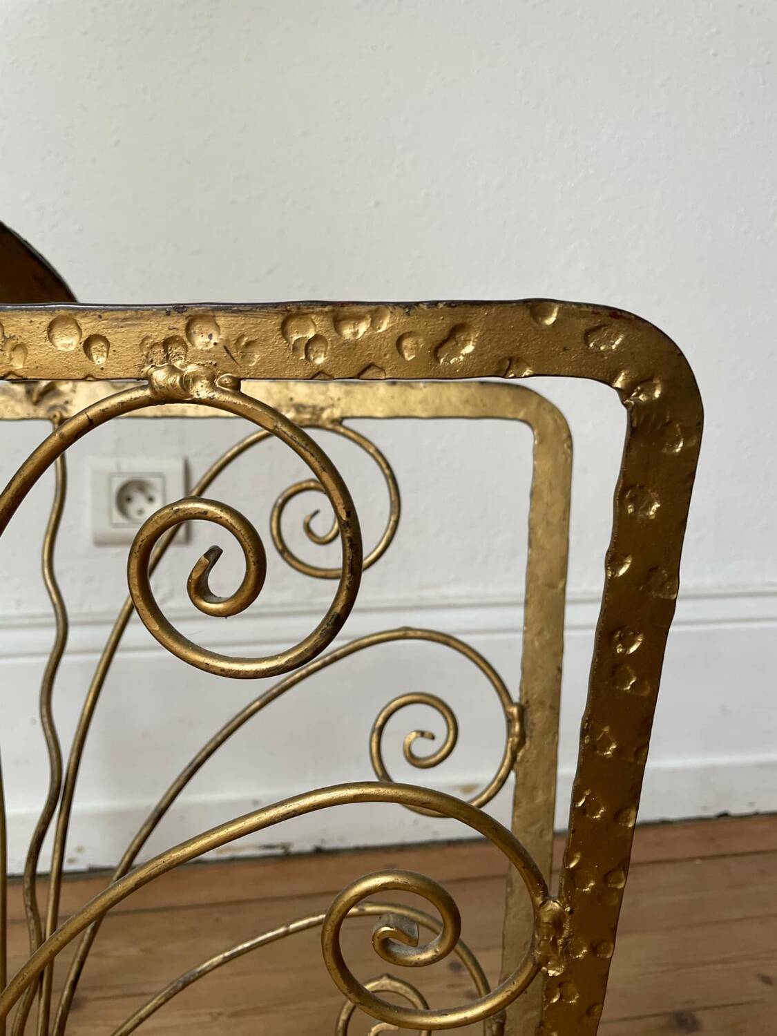 Vintage wrought iron magazine rack with gold butterfly design