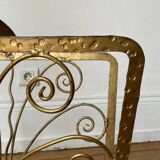 Vintage wrought iron magazine rack with gold butterfly design