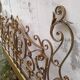 Golden wrought iron bedhead