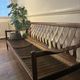 Vintage three-seater sofa — wood and sculptural backrest