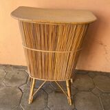 Vintage rattan bar from the 60s with rounded shapes and a shelf for glasses
