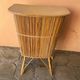 Vintage rattan bar from the 60s with rounded shapes and a shelf for glasses