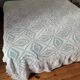 Large white crocheted bedspread