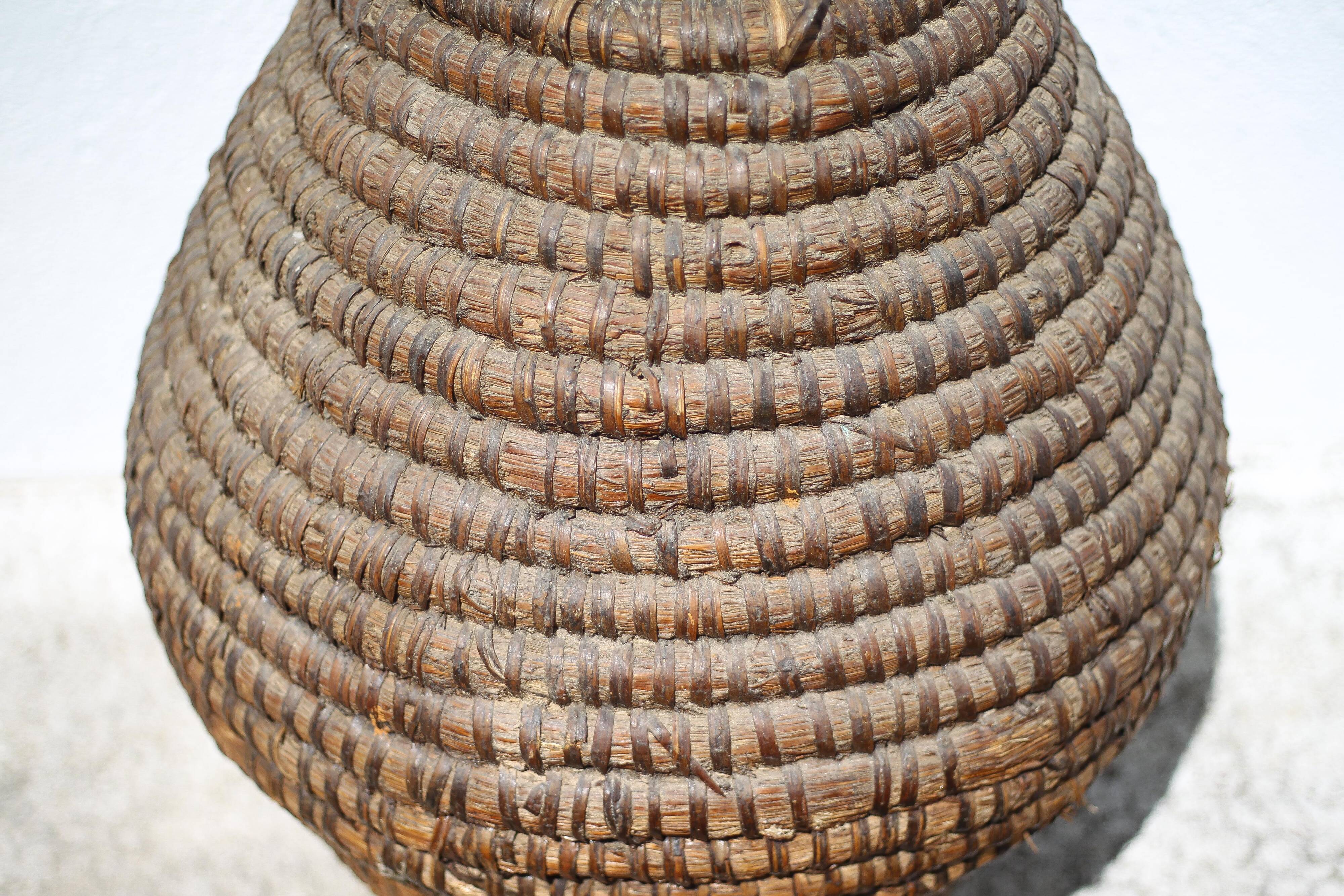 Old basket, burgundy straw and bramble, woven basket, interior decoration
