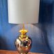 Italian design lamp in silver and gold ceramic. 1970s.