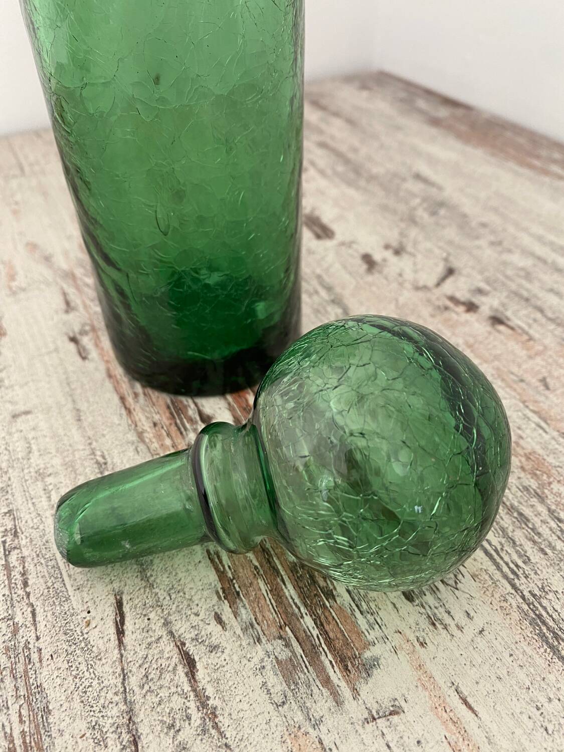 Old cracked glass carafe