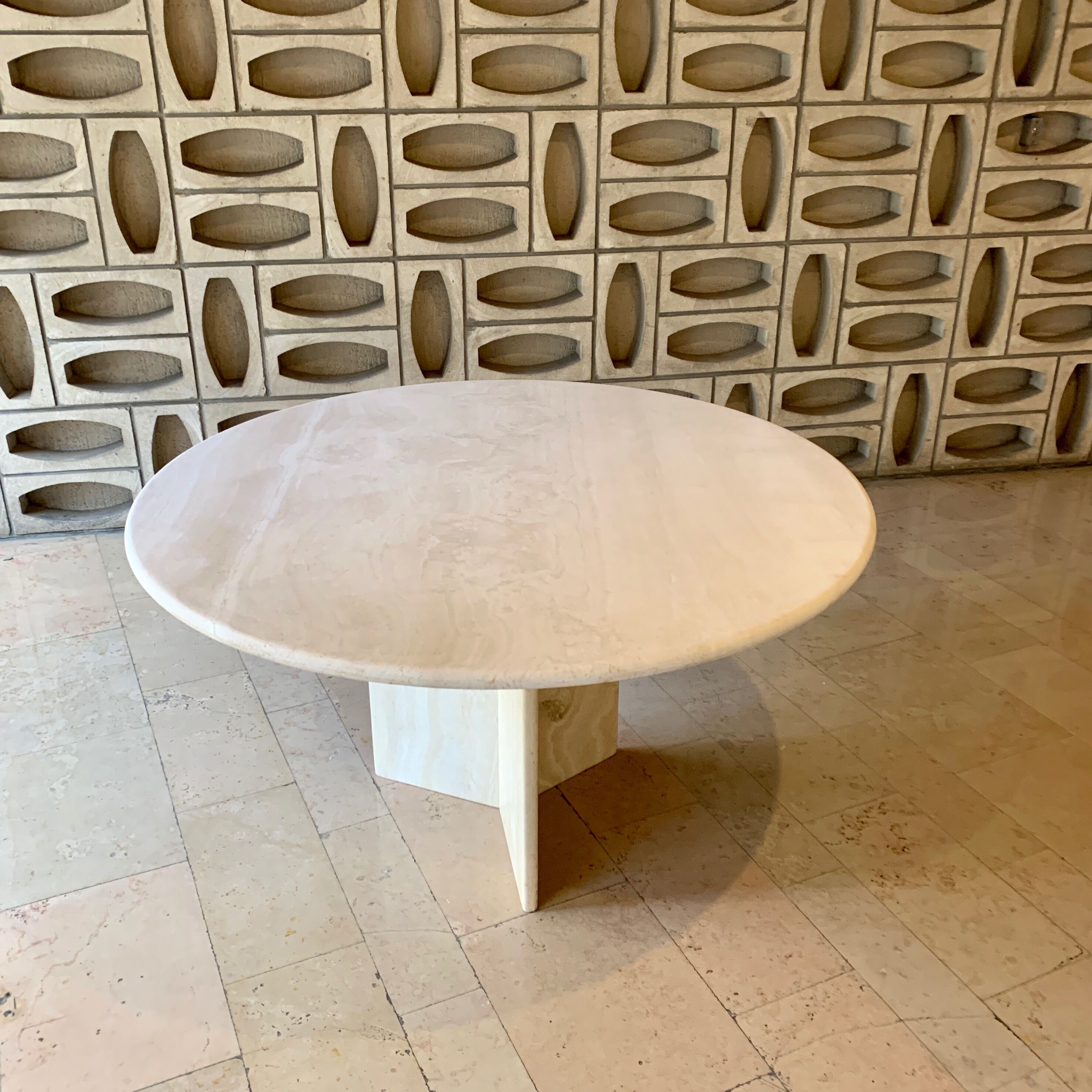 Round travertine dining table
