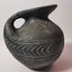 Vintage native american jug pot with geometric patterns in green / gray tones